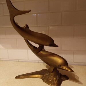 Brass dolphin structure